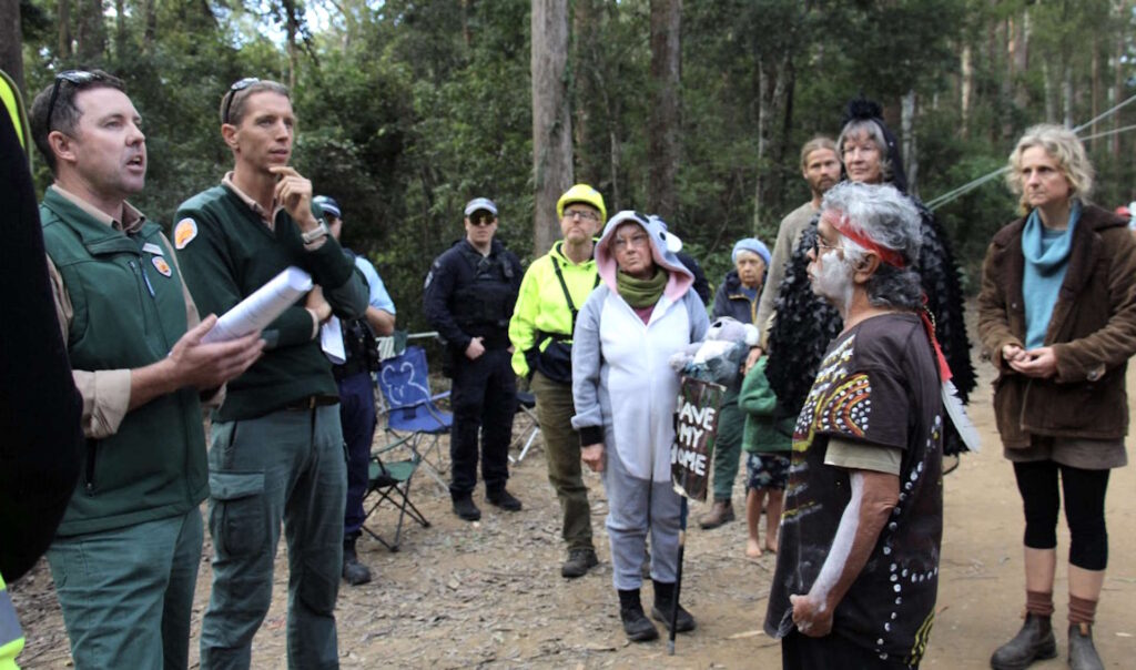 Gumbaynggirr Traditional Owner Alison Buchanan faces down Forestry Officers